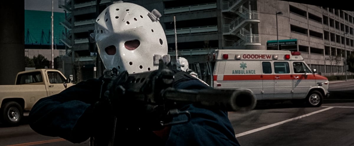 Michael with an FN FAL rifle during the armored car robbery in Heat (1995)